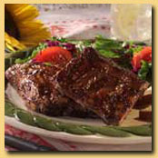 Offering wood smoked BBQ meats including Roasted Whole Hogs, Pulled Pork and Baby Back Ribs.